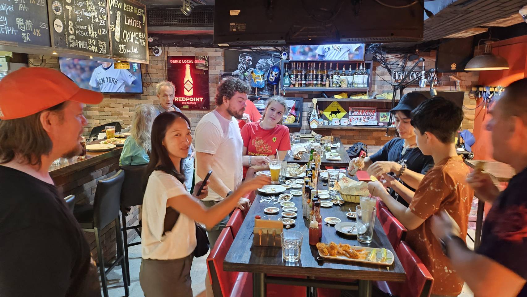 People enjoying food and drinks together.